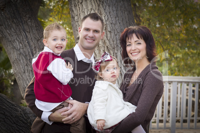 Young Attractive Parents and Children Portrait in Park