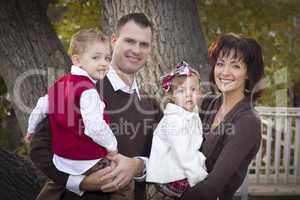 Young Attractive Parents and Children Portrait in Park