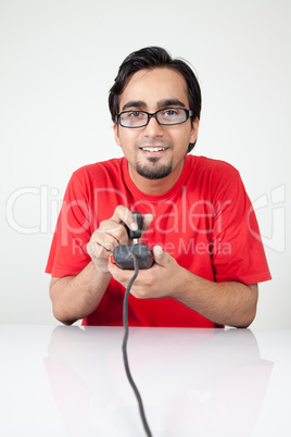 Nerd playing retro game, holding joystick