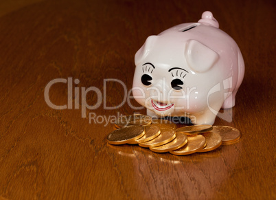 Piggy bank with gold coins