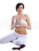 happy woman sit in yoga with beads and phone