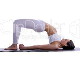 woman stand on spine - doing yoga asana isolated
