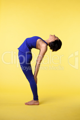 happy woman stand in blue on yellow