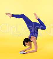 happy woman arm balance yoga  blue on yellow