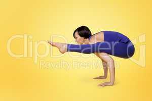 woman doing yoga arm balance and smile