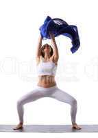 woman doing yoga with blue cloth in air isolated