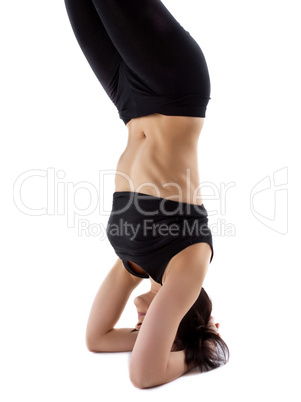 woman stand on head - doing yoga asana