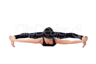 woman sit in yoga asana - doing split