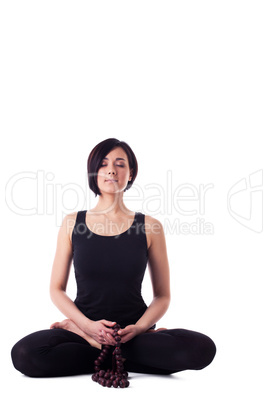 happy woman sit in yoga meditation pose with beads