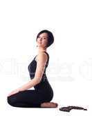 happy woman sit in yoga meditation pose with beads