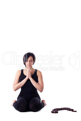 woman sit in yoga meditation pose pray with beads