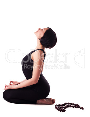 happy woman sit in yoga meditation pose with beads