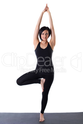 woman stand on one leg in yoga pose isolated