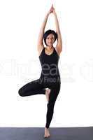 woman stand on one leg in yoga pose isolated