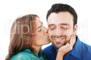 Lovely woman kissing her boyfriend, isolated on white