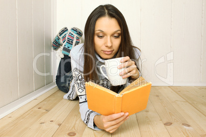 Young woman reads a book