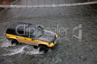 jeep crossing a river