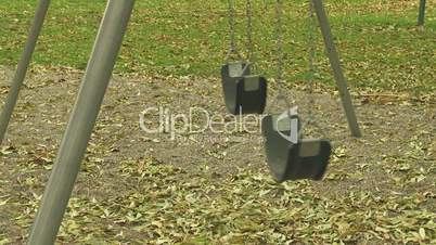 Empty swings in a children's playground