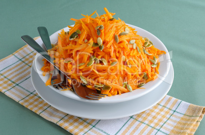 Salad of pumpkin and carrot with pumpkin seeds