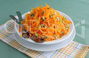 Salad of pumpkin and carrot with pumpkin seeds