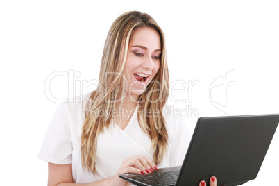 A woman doctor is surprised and looking at her laptop.