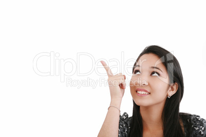 Attractive young woman points to something above her head