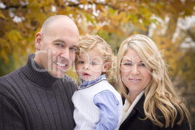 Young Attractive Parents and Child Portrait in Park