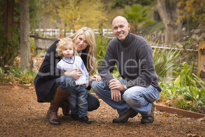 Young Attractive Parents and Child Portrait in Park