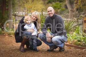 Young Attractive Parents and Child Portrait in Park