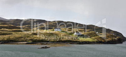 two remote houses at coastline