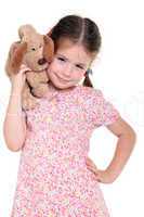 Little girl with a soft toy on the white background
