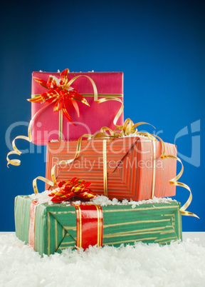 Christmas presents against blue background