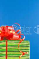 Green box with present against blue background