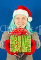 Teen girl holds a Christmas present