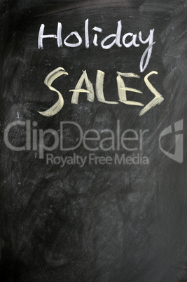 Holiday sales written on a blackboard
