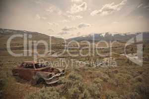 Old abandoned car with bullet holes