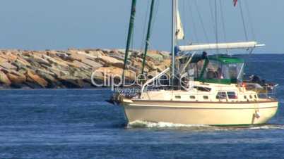 Sailboat Enters Canal