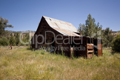 Old barn house with a blue clear sky Old barn house with a blue clear sky