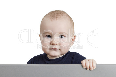 young child holding sign