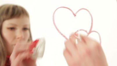 Girl wipes off small hearts