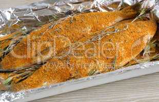 Herring in spices and herbs in foil