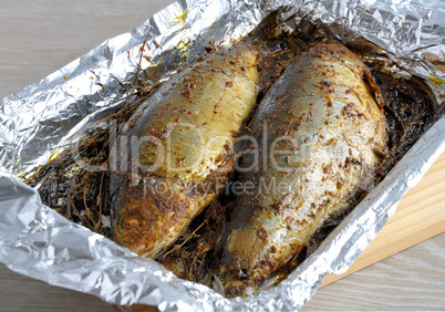 Herring in spices and herbs in foil