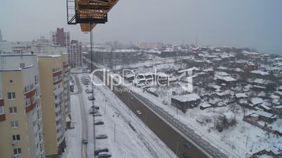 Winter construction. With the boom of a crane.