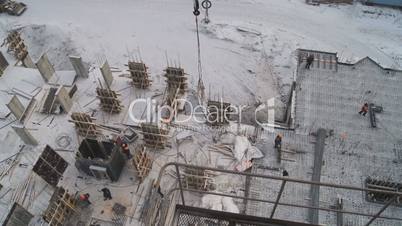 Winter construction. With the boom of a crane.