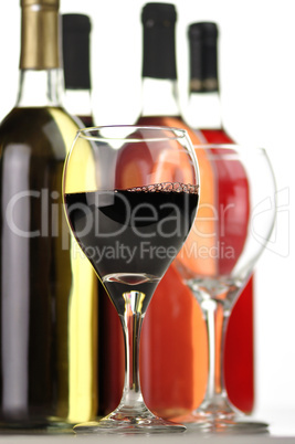 assortment of wine bottles and glasses
