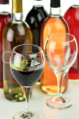 assortment of wine bottles and glasses