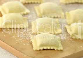 Uncooked Ravioli on a cutting board