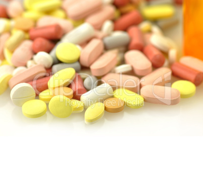Medicine bottles and pills close up