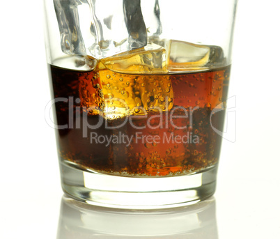 glass of cola with ice cubes