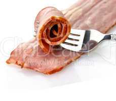 turkey bacon with fork close up